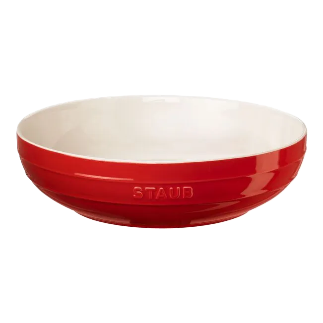 Red Staub bowl on a white background