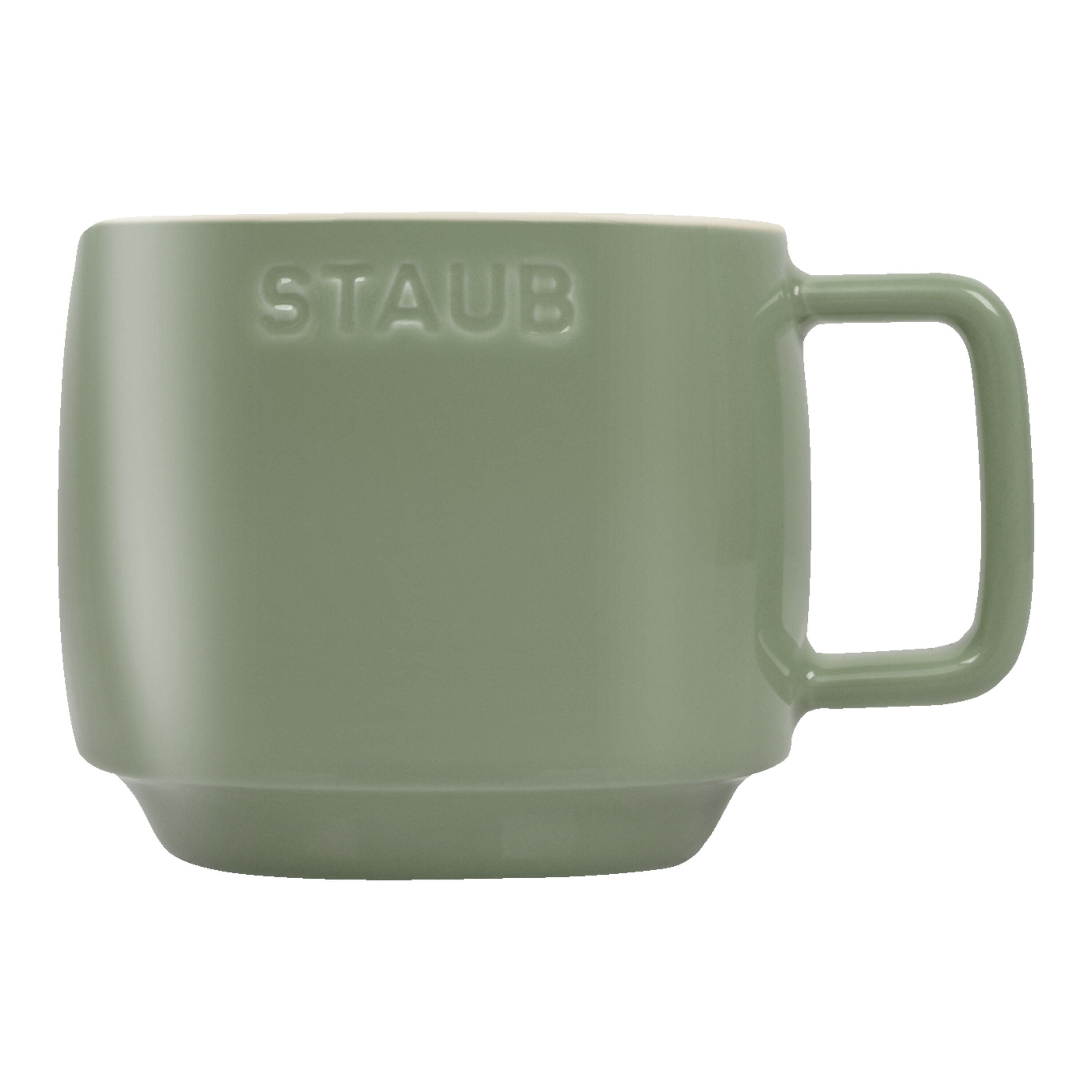 Green mug with 'STAUB' branding on a white background