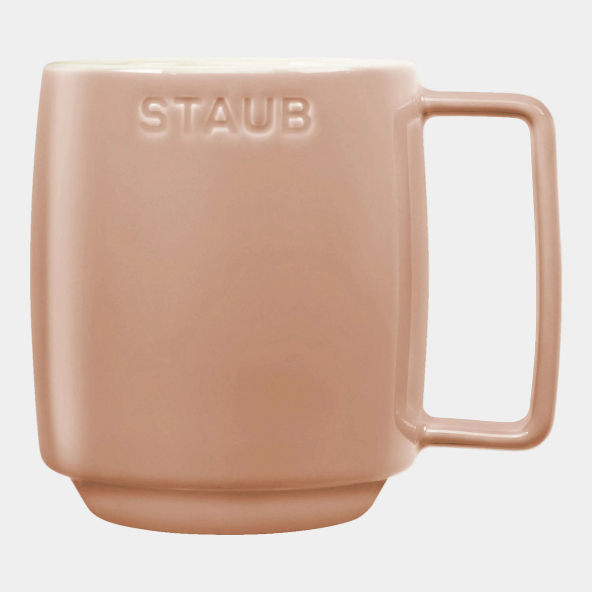 Pink mug with 'STAUB' branding on a white background