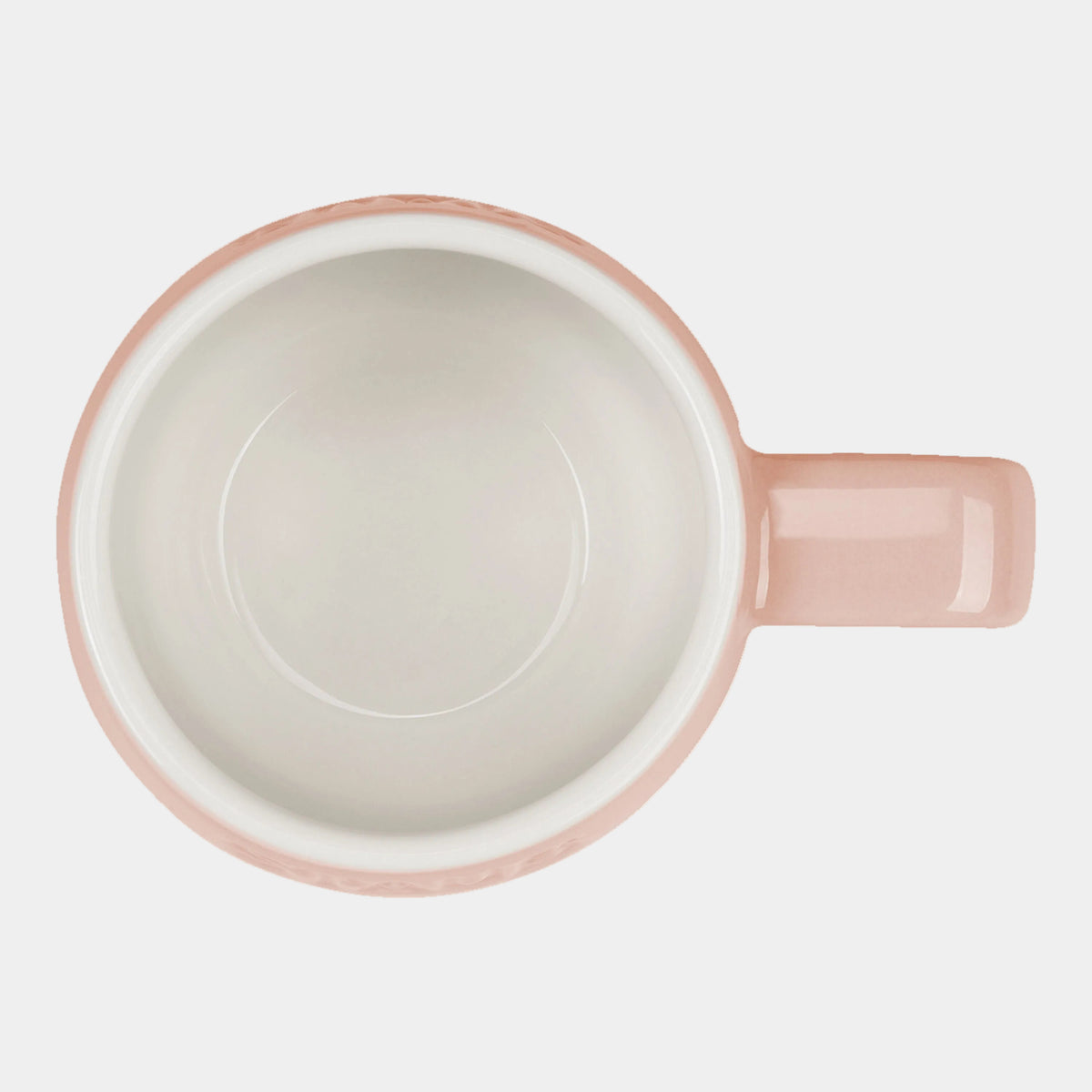 Pink ceramic mug on a white background