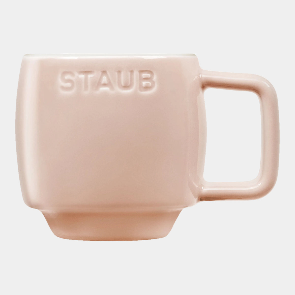 Pink mug with 'STAUB' branding on a white background