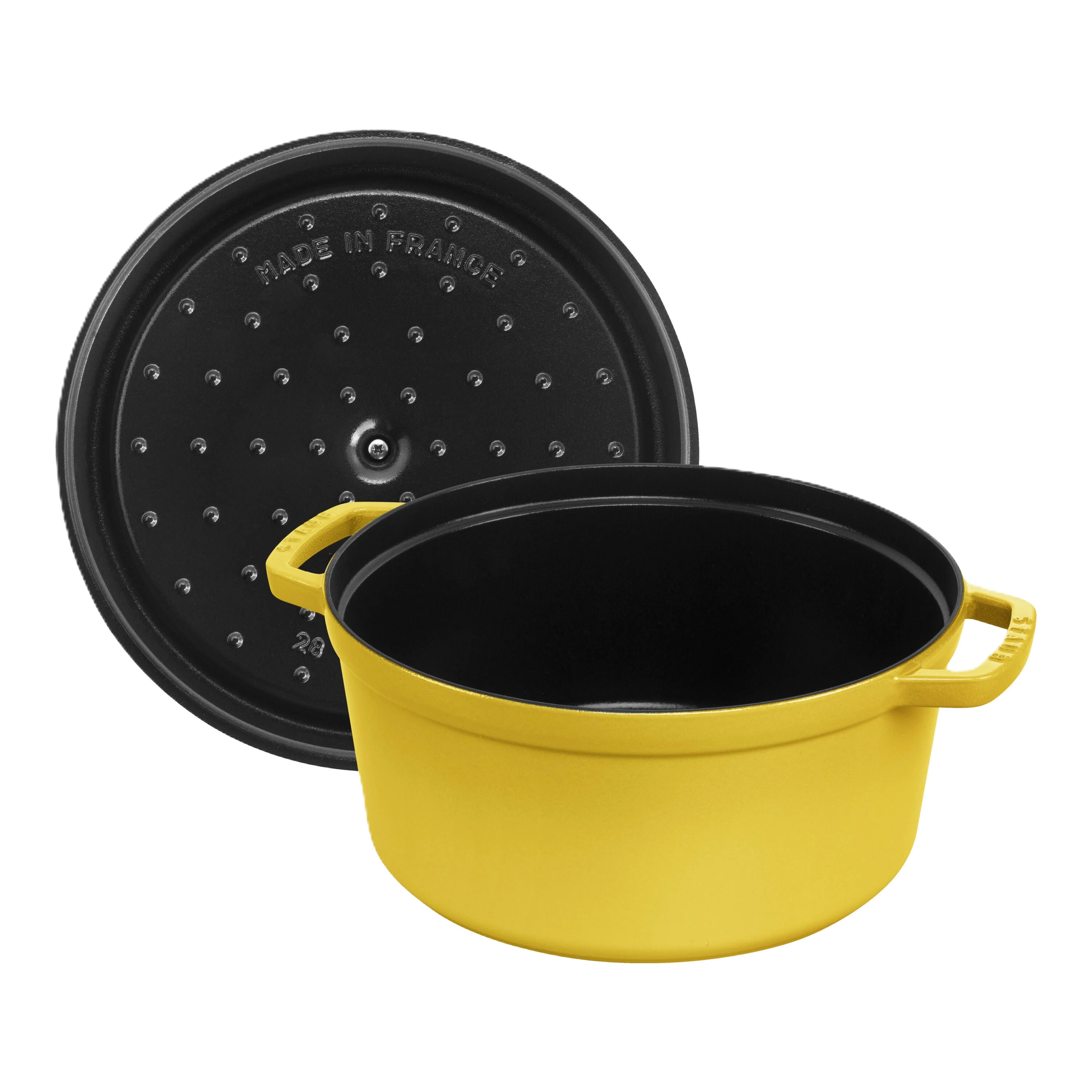 Yellow cast iron pot with black lid on a white background