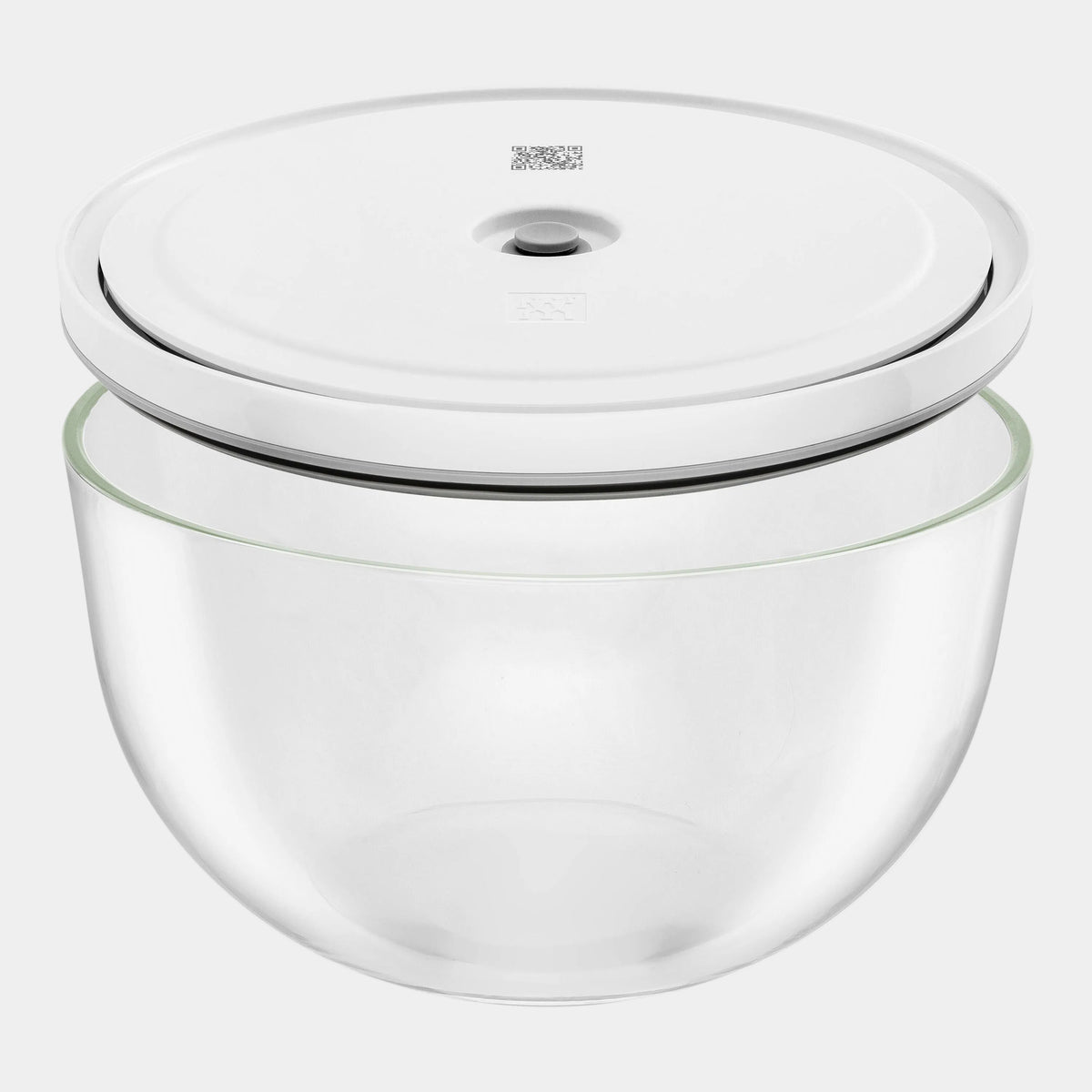 Clear glass container with a white lid on a white background