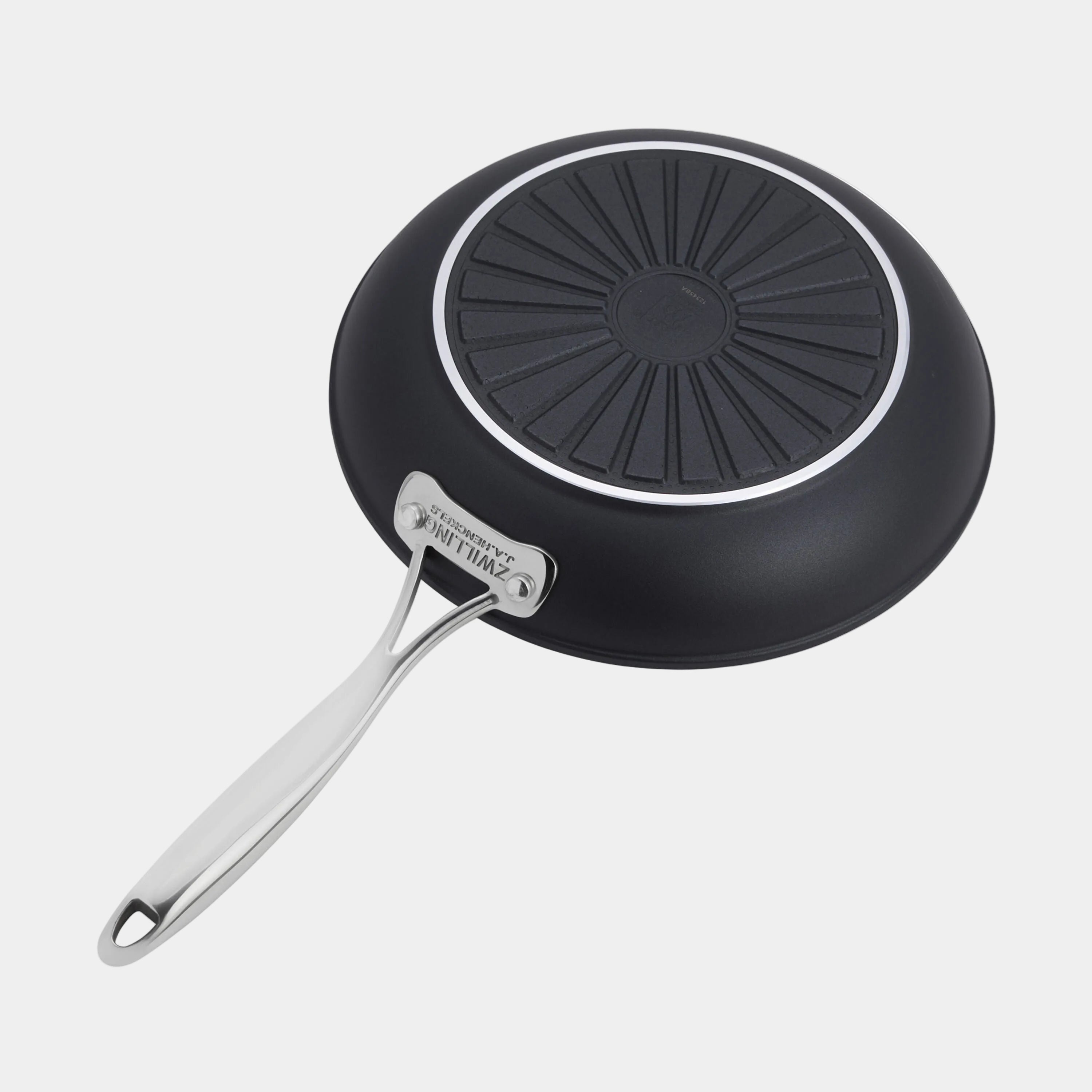 Black frying pan with a silver handle on a white background