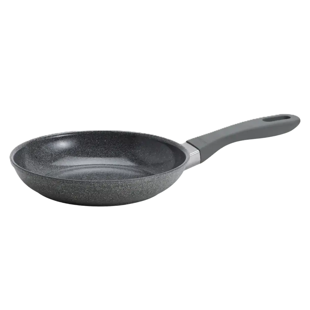 Black frying pan with a handle on a white background