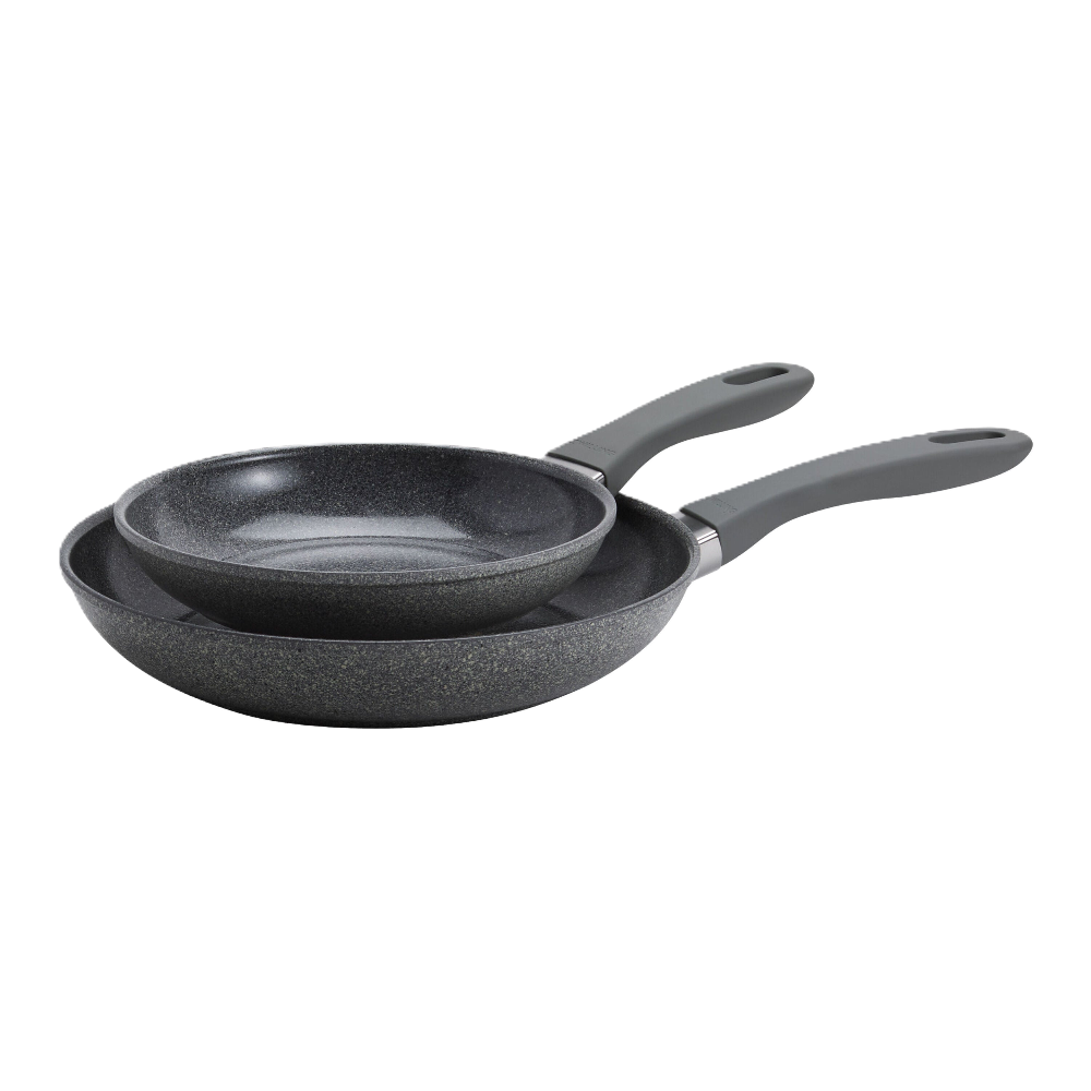 Set of two gray frying pans on a white background