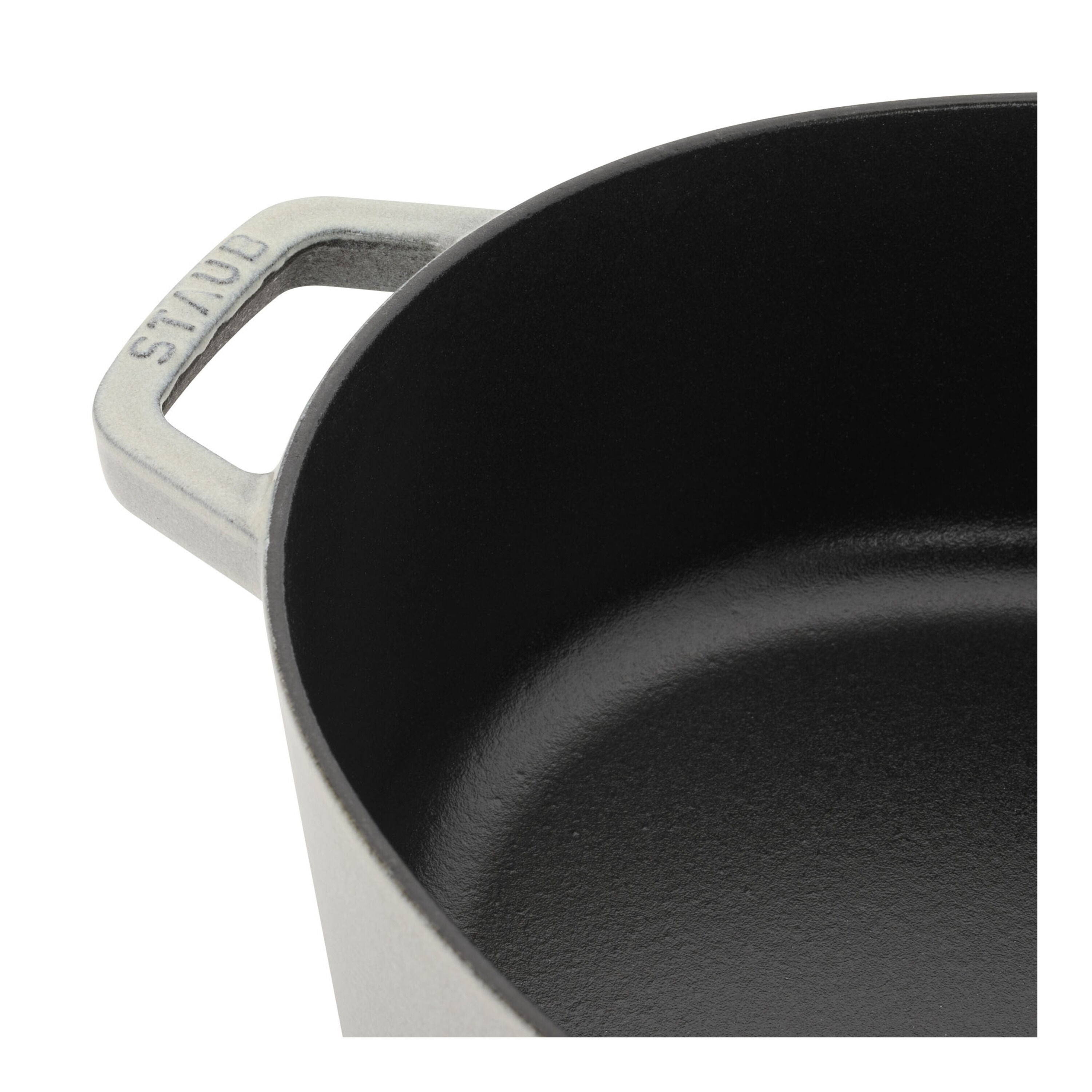 Detail of STAUB La Cocotte 6 L Cast Iron Oval Wide Oval Dutch Oven, White Truffle, showcasing the interior and handle.