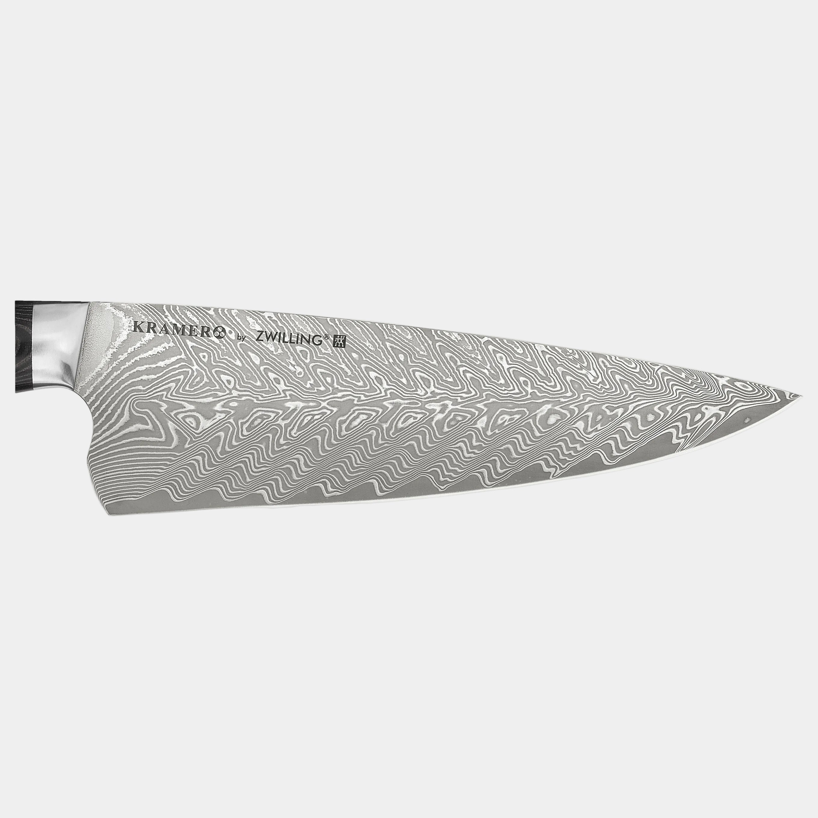 Chef's knife with a detailed blade pattern on a white background