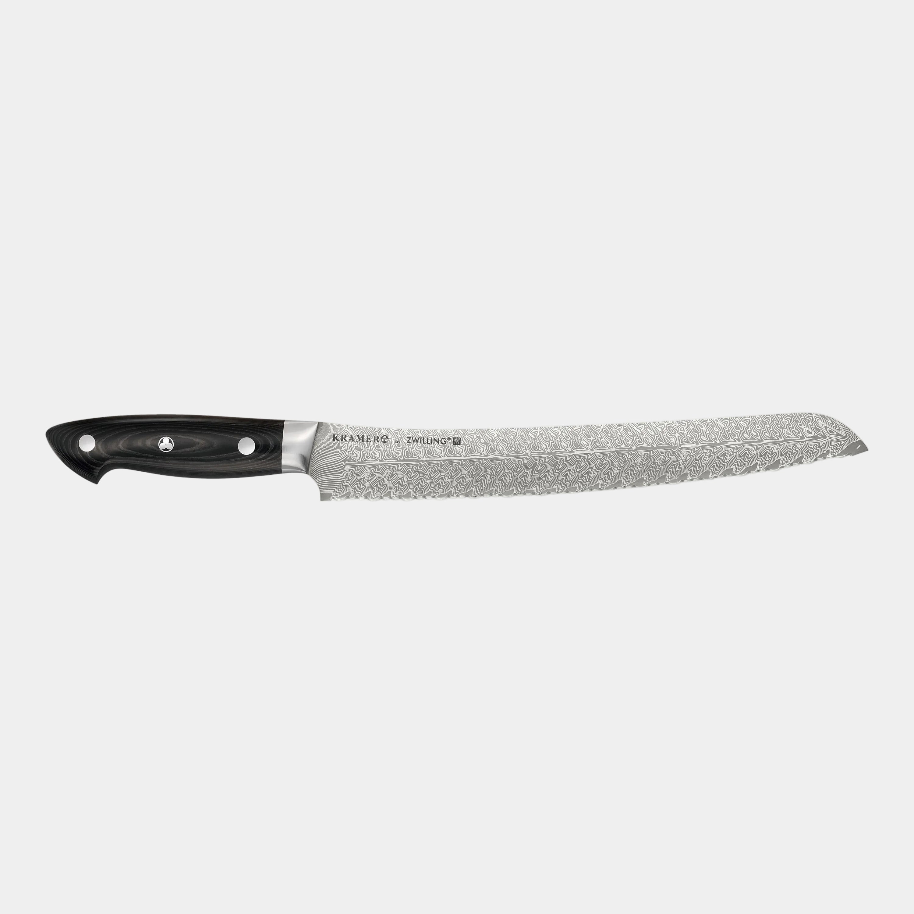 Chef's knife with a black handle on a white background