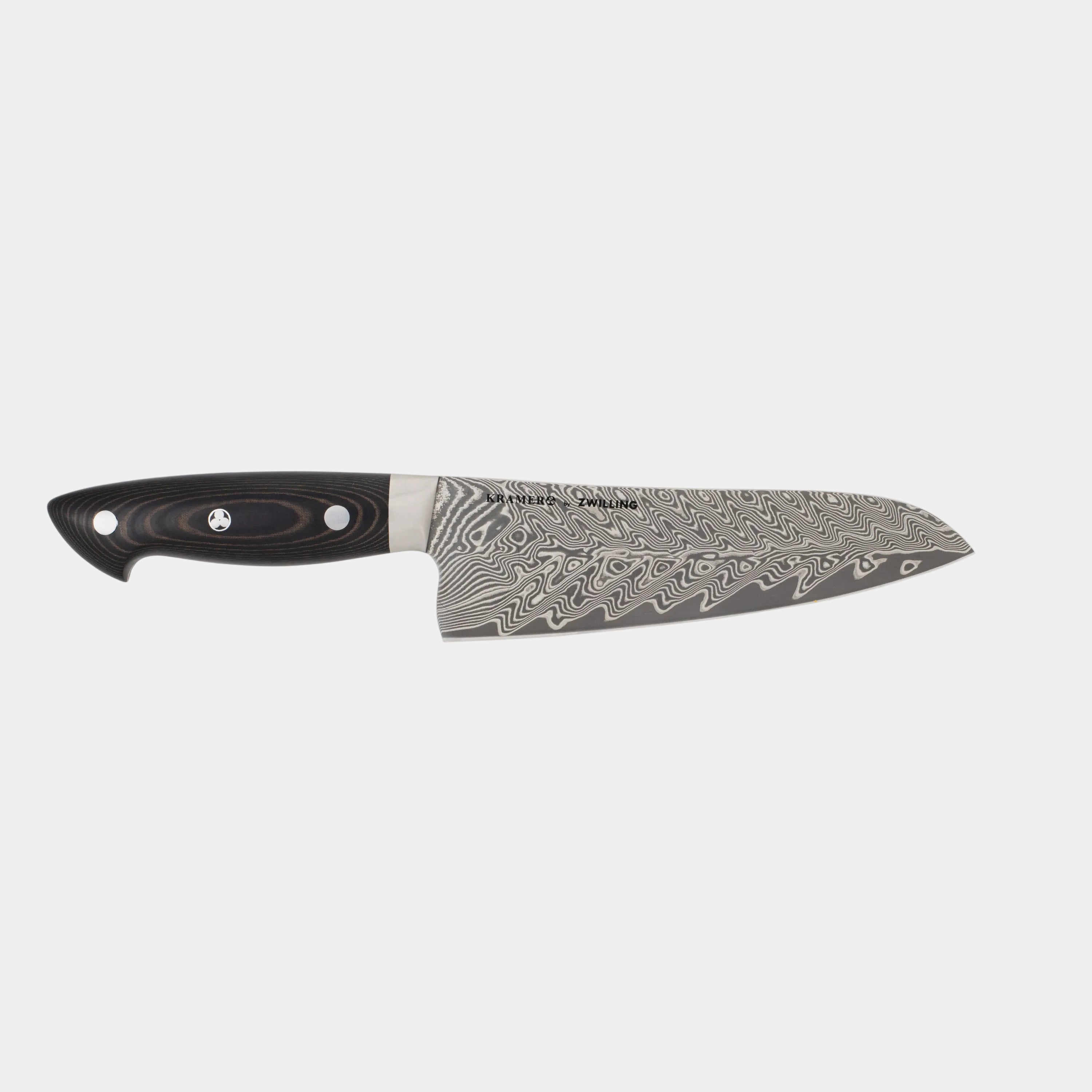 Chef's knife with a black handle and decorative blade on a white background