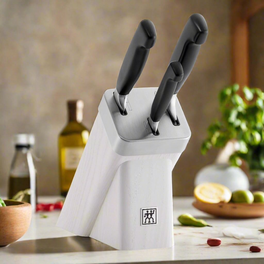 ZWILLING **** Four Star 4 Piece Self Sharpening Block Set, White in a kitchen setting with knives.