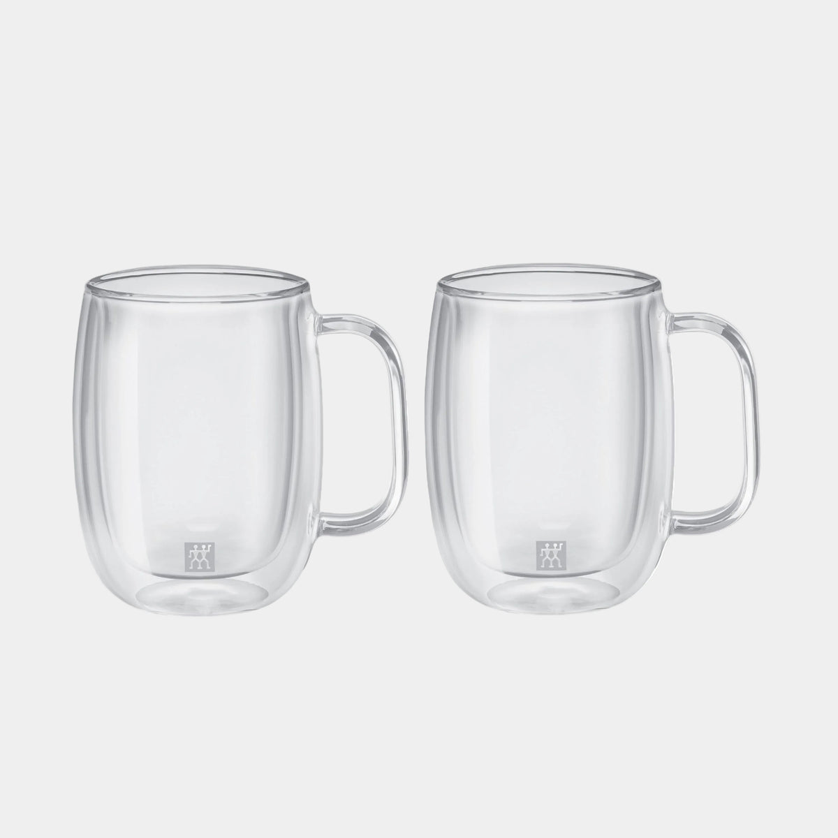 Two clear glass mugs with handles on a white background