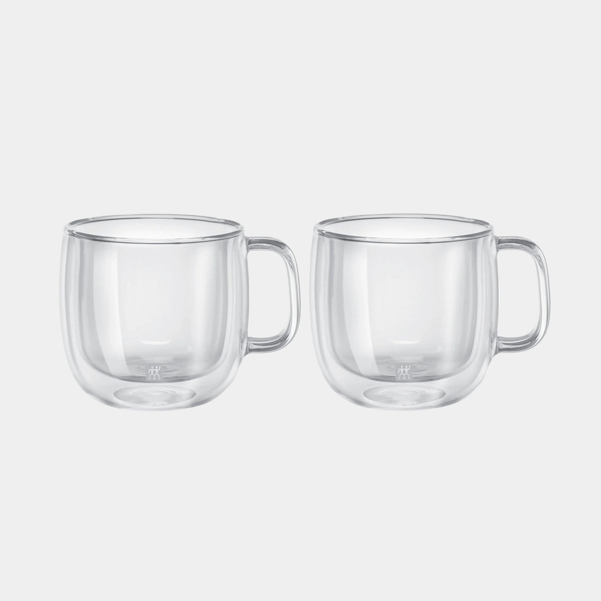 Two clear glass mugs with handles on a white background