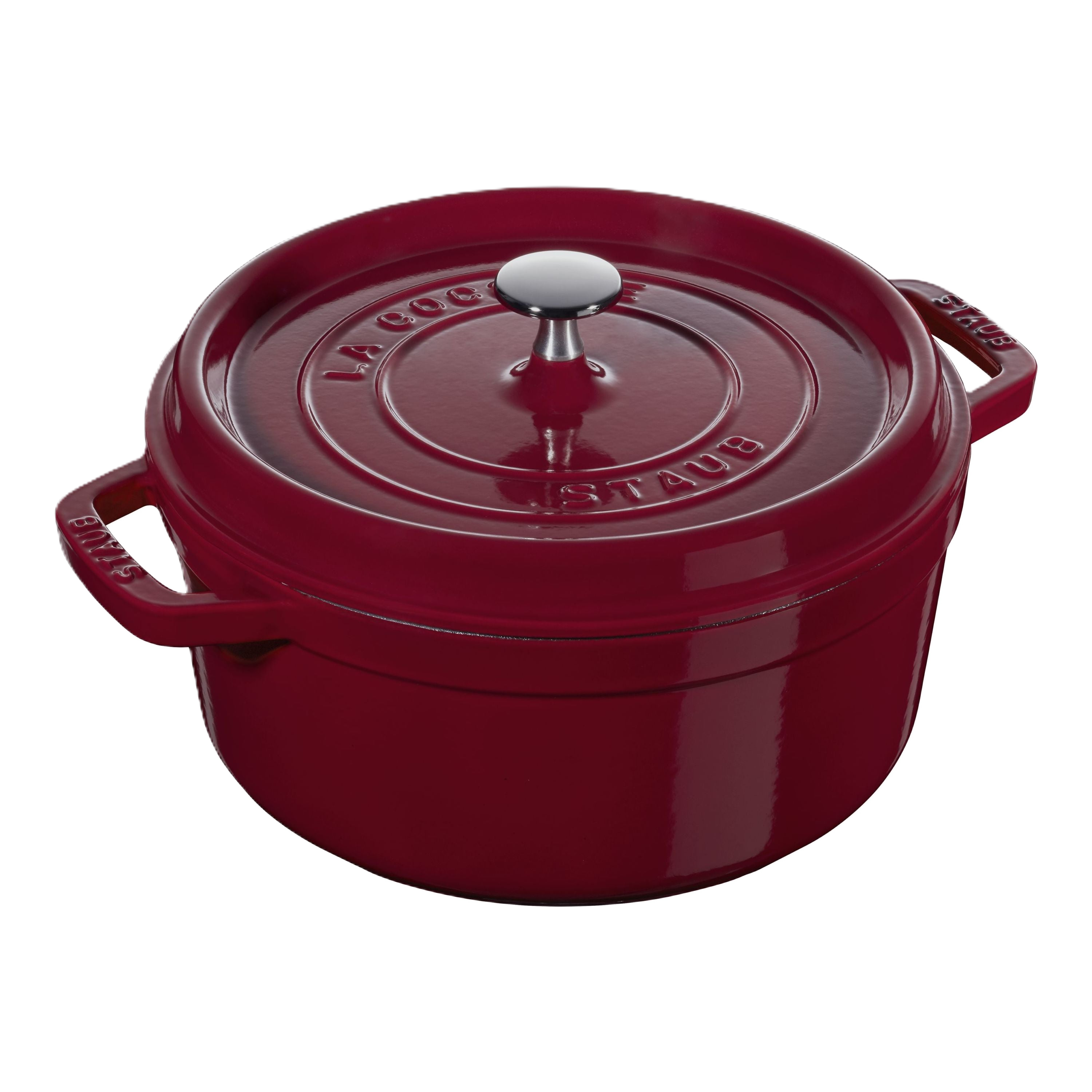 Red Staub cocotte with a silver knob on a white background