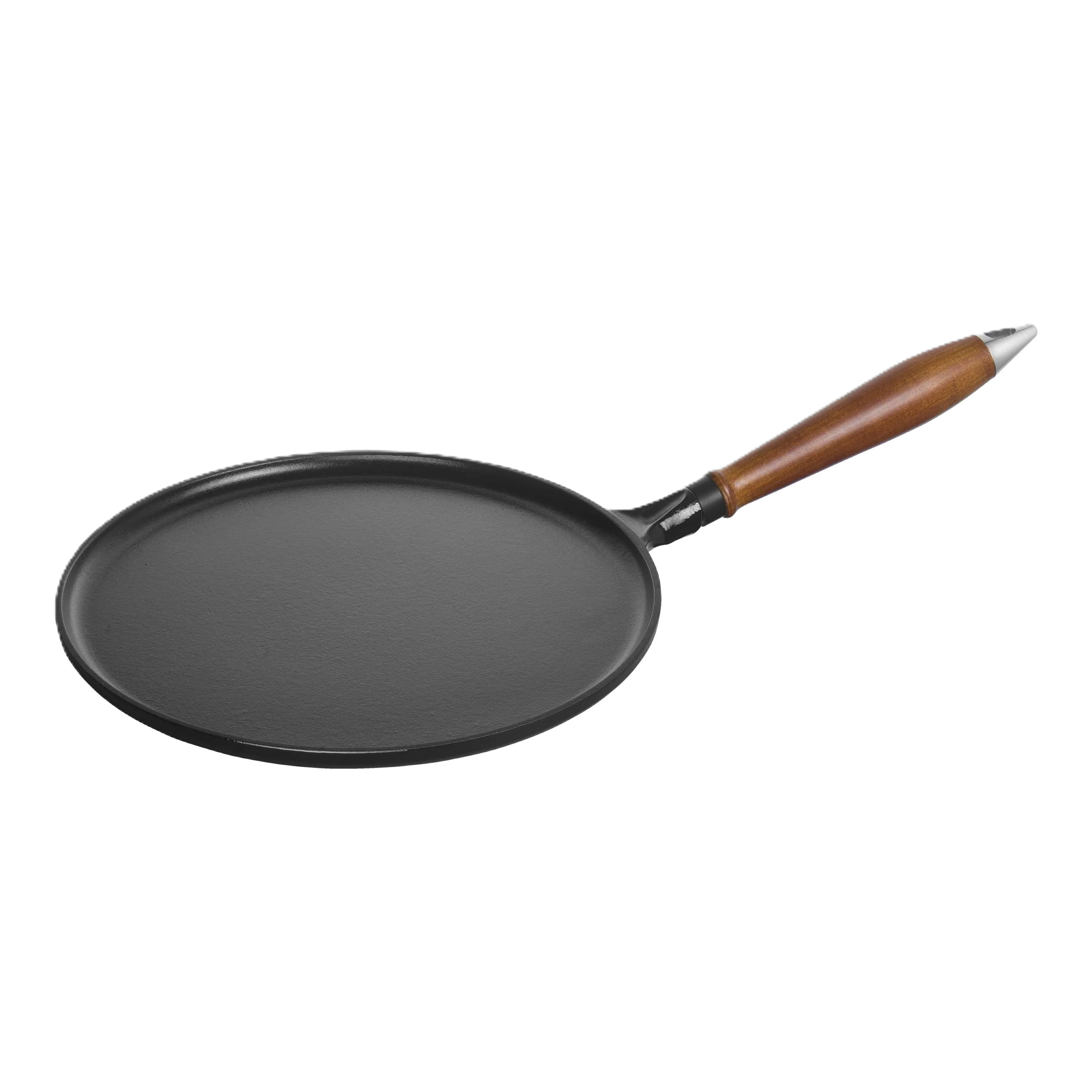 Black frying pan with a wooden handle on a white background