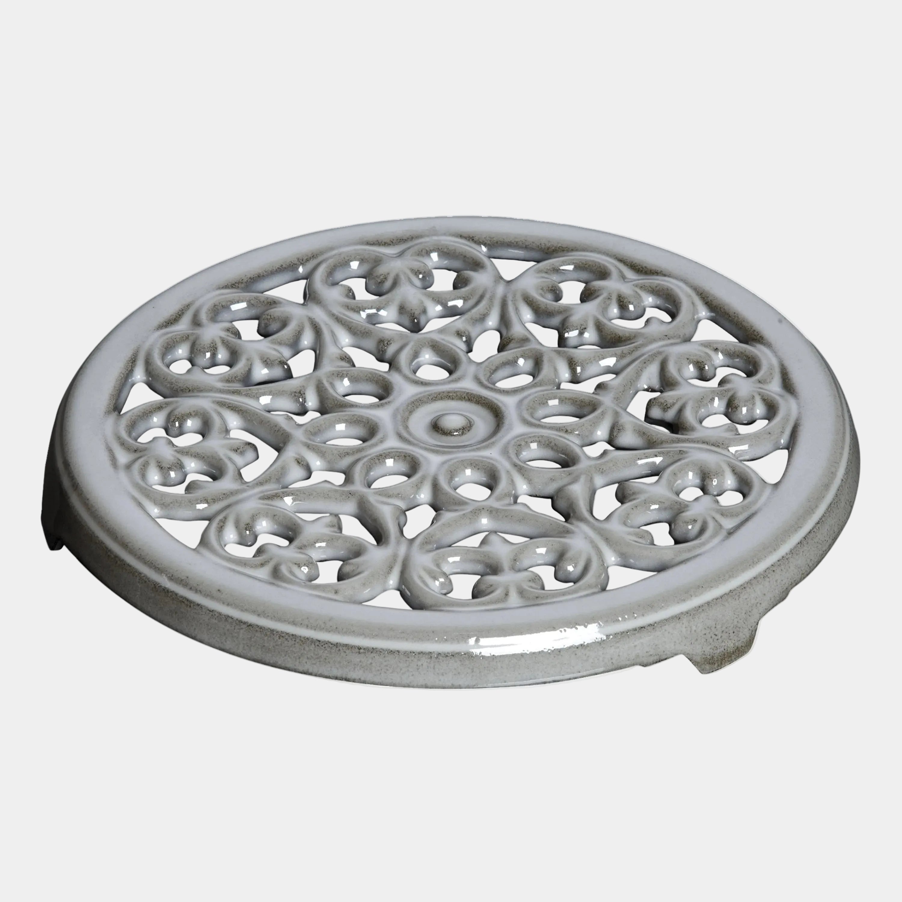 STAUB Serving Round Cast Iron Trivet, Lily Decal, Graphite-Grey, 23 cm diameter, heat-resistant kitchen accessory, elegant design.