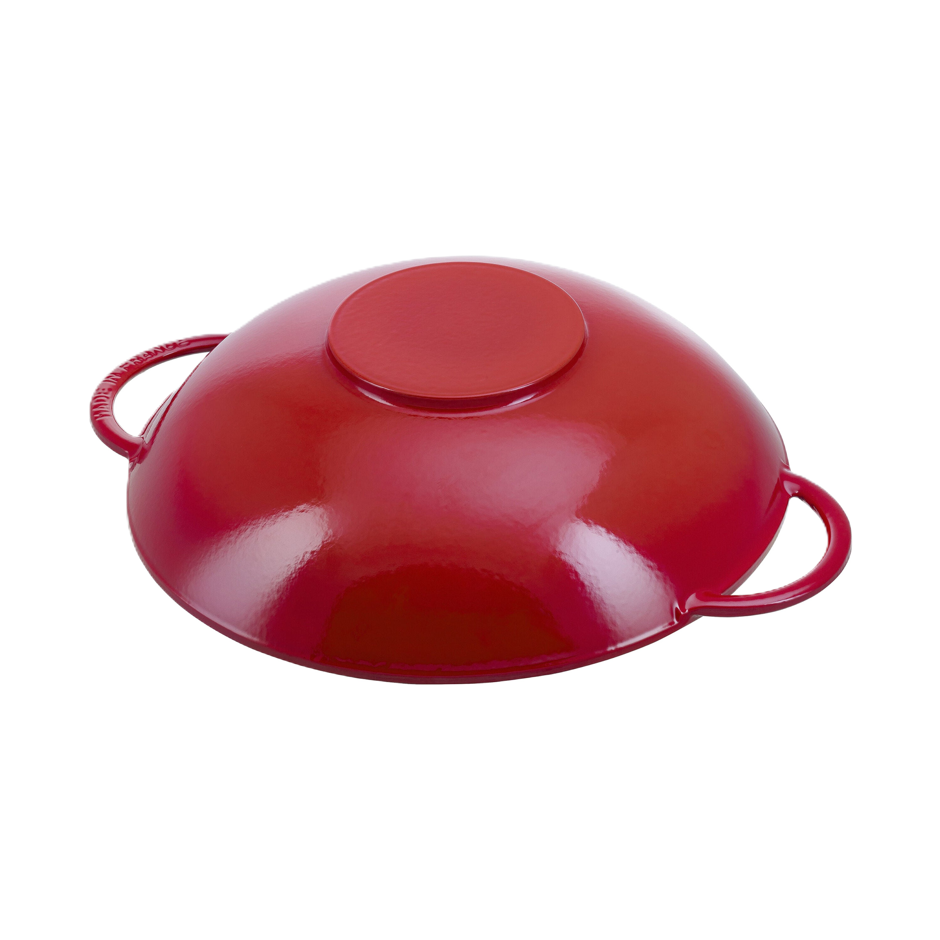 Red plastic lid with handles on a white background upside down