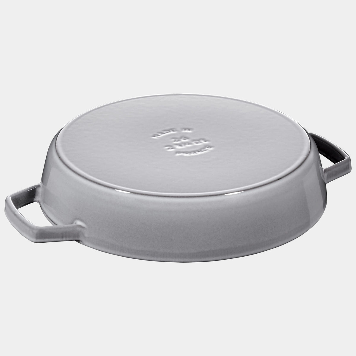 Gray cast iron skillet with lid on a white background