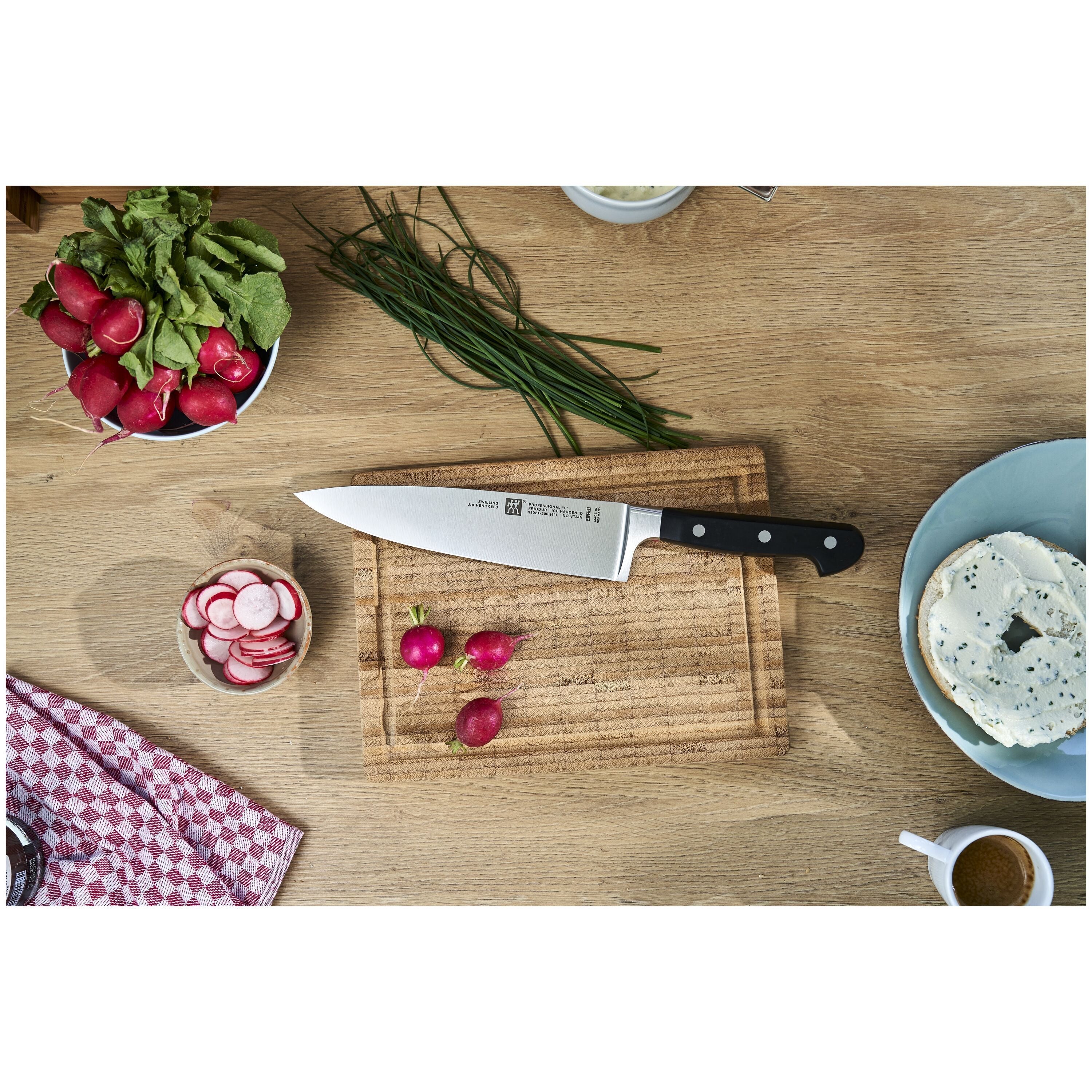ZWILLING Professional S 7 Piece, Knife Block Set displayed with fresh ingredients on a wooden cutting board.