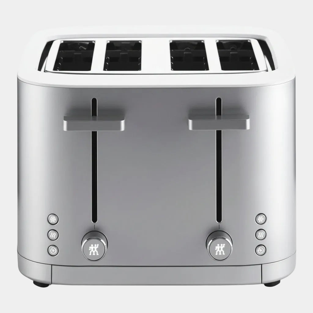 Silver toaster with four slices of bread on a white background