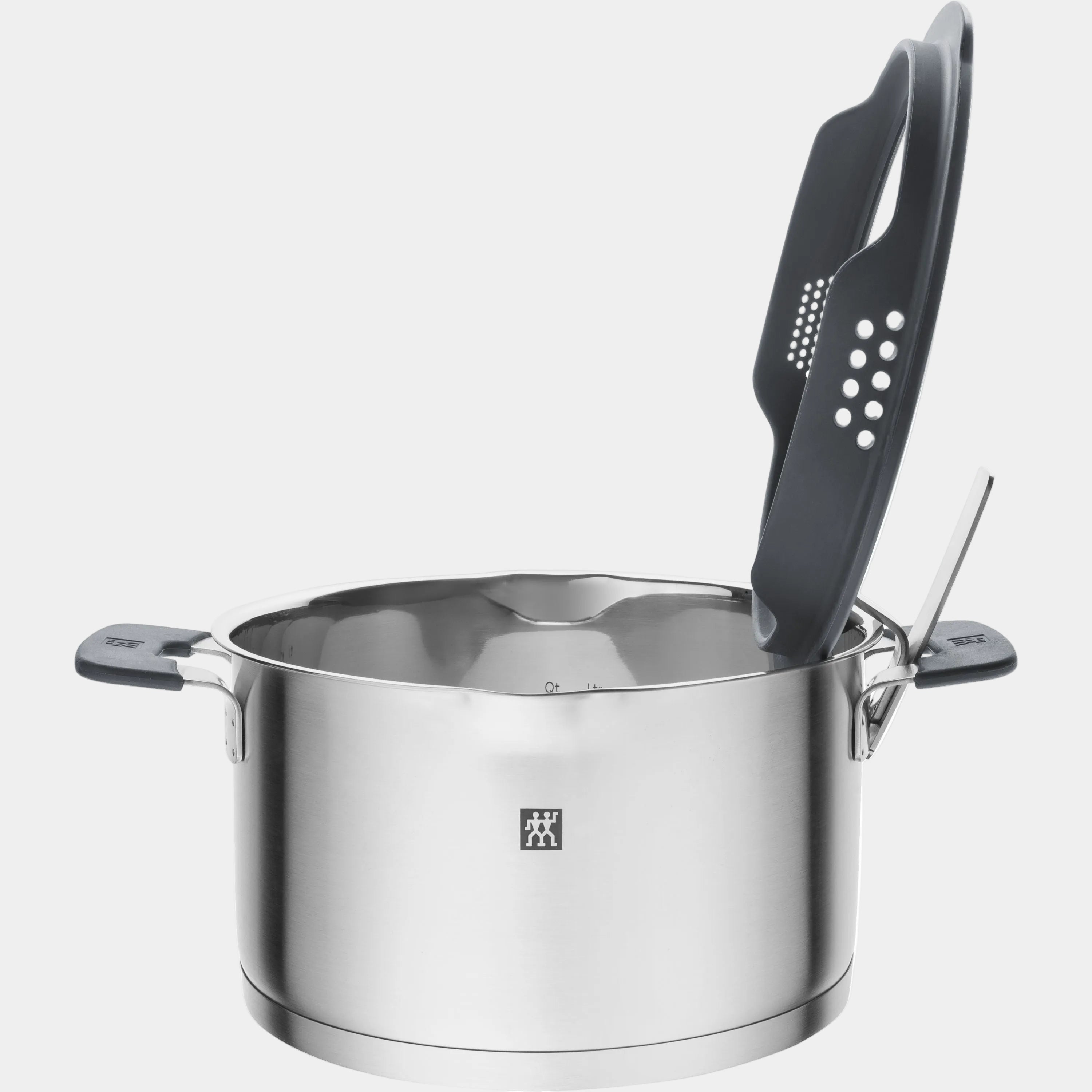 Stainless steel pot with a ladle on a white background