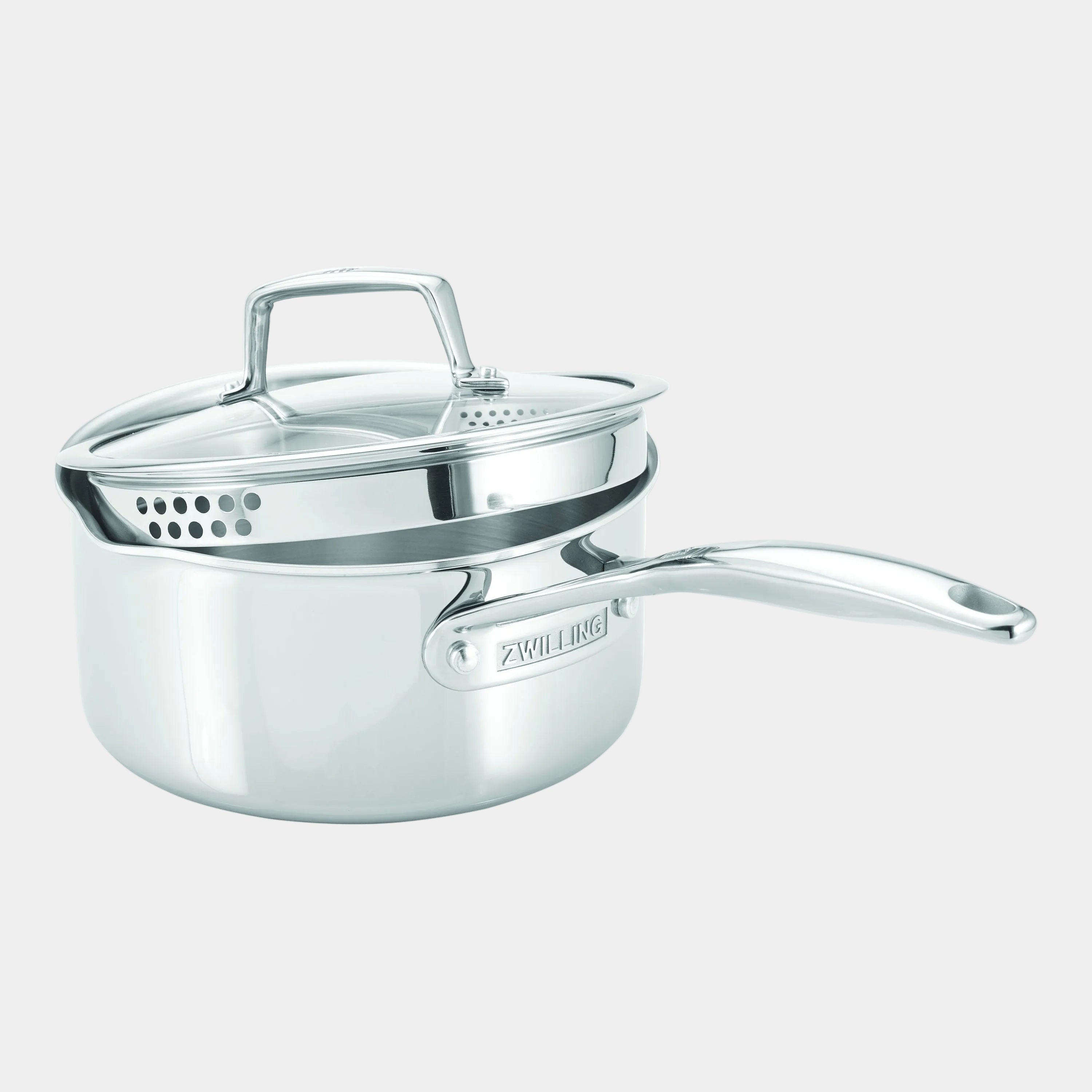 Stainless steel saucepan with lid on a white background