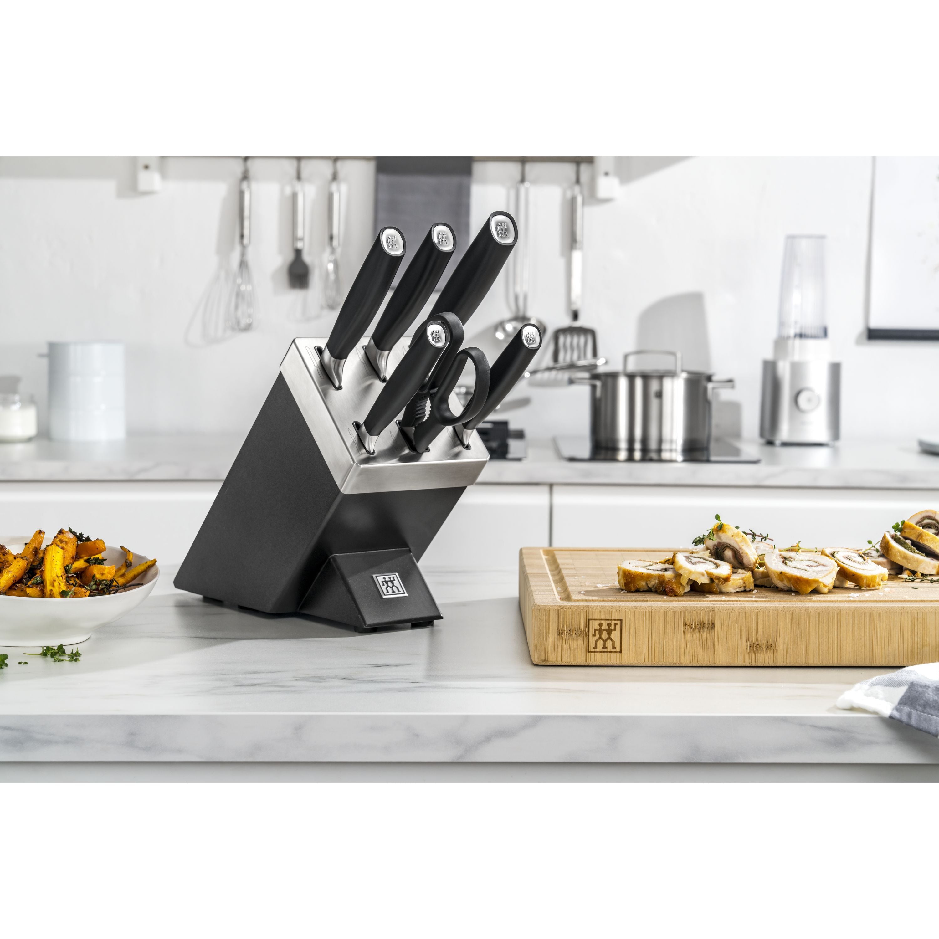 ZWILLING All * Star 7 Piece Knife Block Set, Silver displayed on a kitchen counter with vegetables.