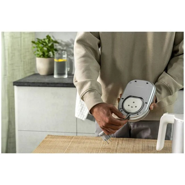 Person placing ZWILLING Enfinigy 1 L Electric Kettle Pro - Silver in kitchen setting