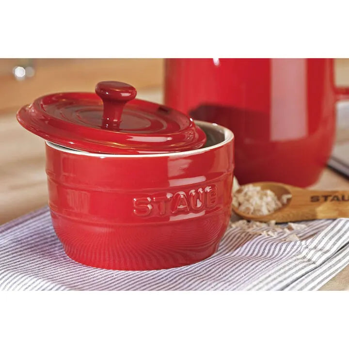 STAUB Ceramique Ceramic Salt Crock with lid on a striped cloth