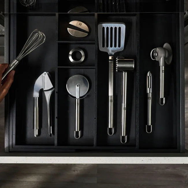 ZWILLING Pro Frying Pan Turner with stainless steel kitchen utensils in a drawer, designed by Matteo Thun and Antonio Rodriguez.
