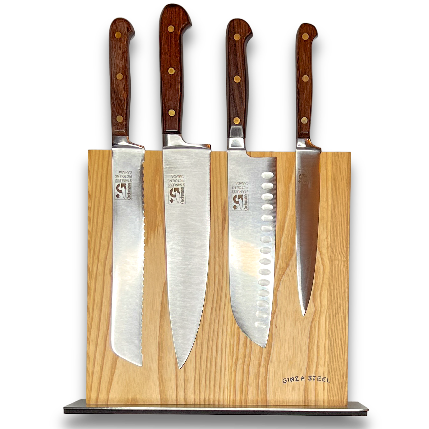 Set of four knives with wooden handles on a magnetic wooden block