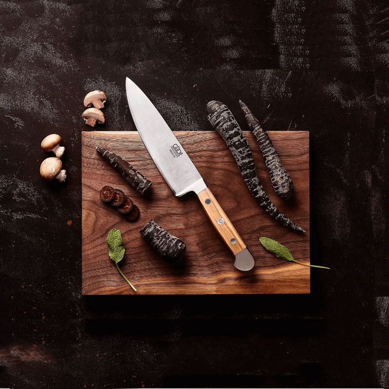 GÜDE Alpha Olive chef knife on cutting board