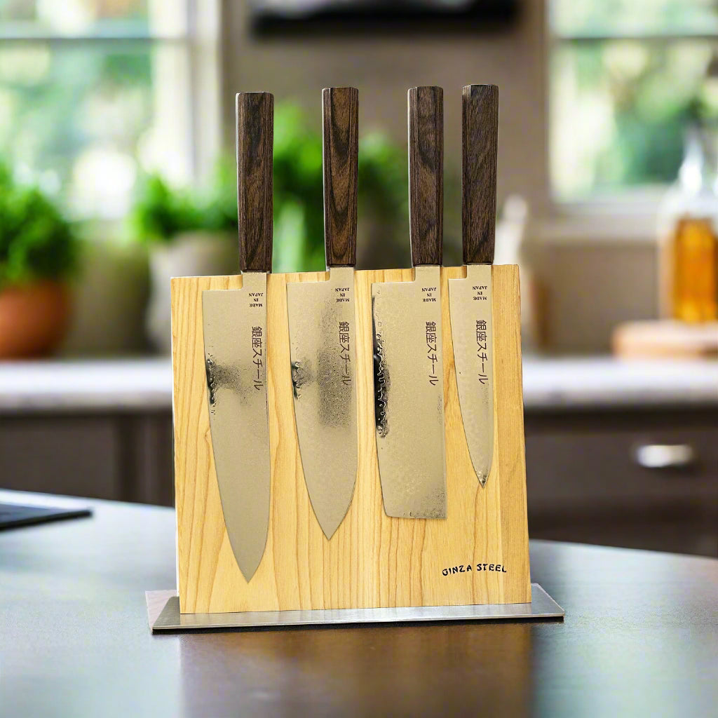 Ginza Steel SEIRYŪ (青龍) FIVE PRO 5-Piece Knife Set with Magnetic Block displayed on a kitchen countertop.