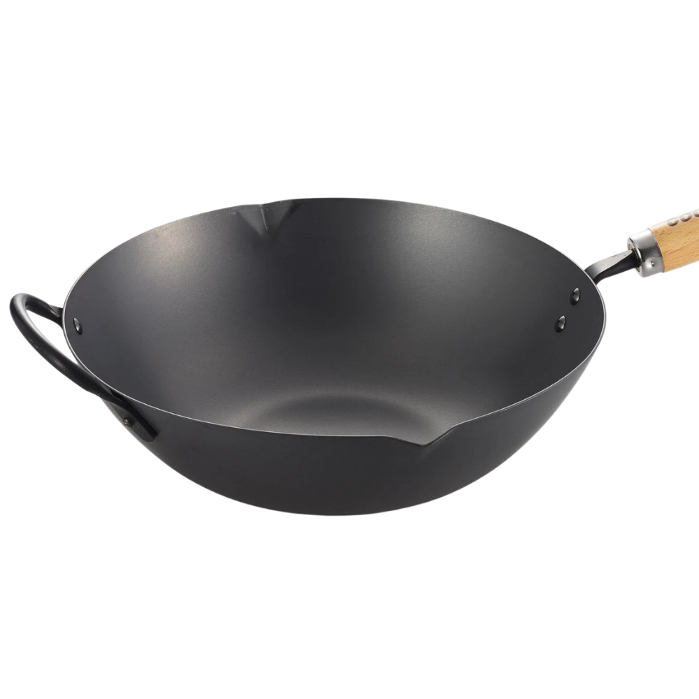 Black wok with a wooden handle on a white background