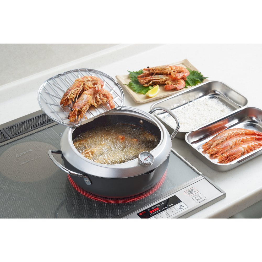 Yoshikawa GOGI Tempura Pot with stainless-steel drip lid on stove, showing shrimp frying and plated on induction cooktop, made in Japan.