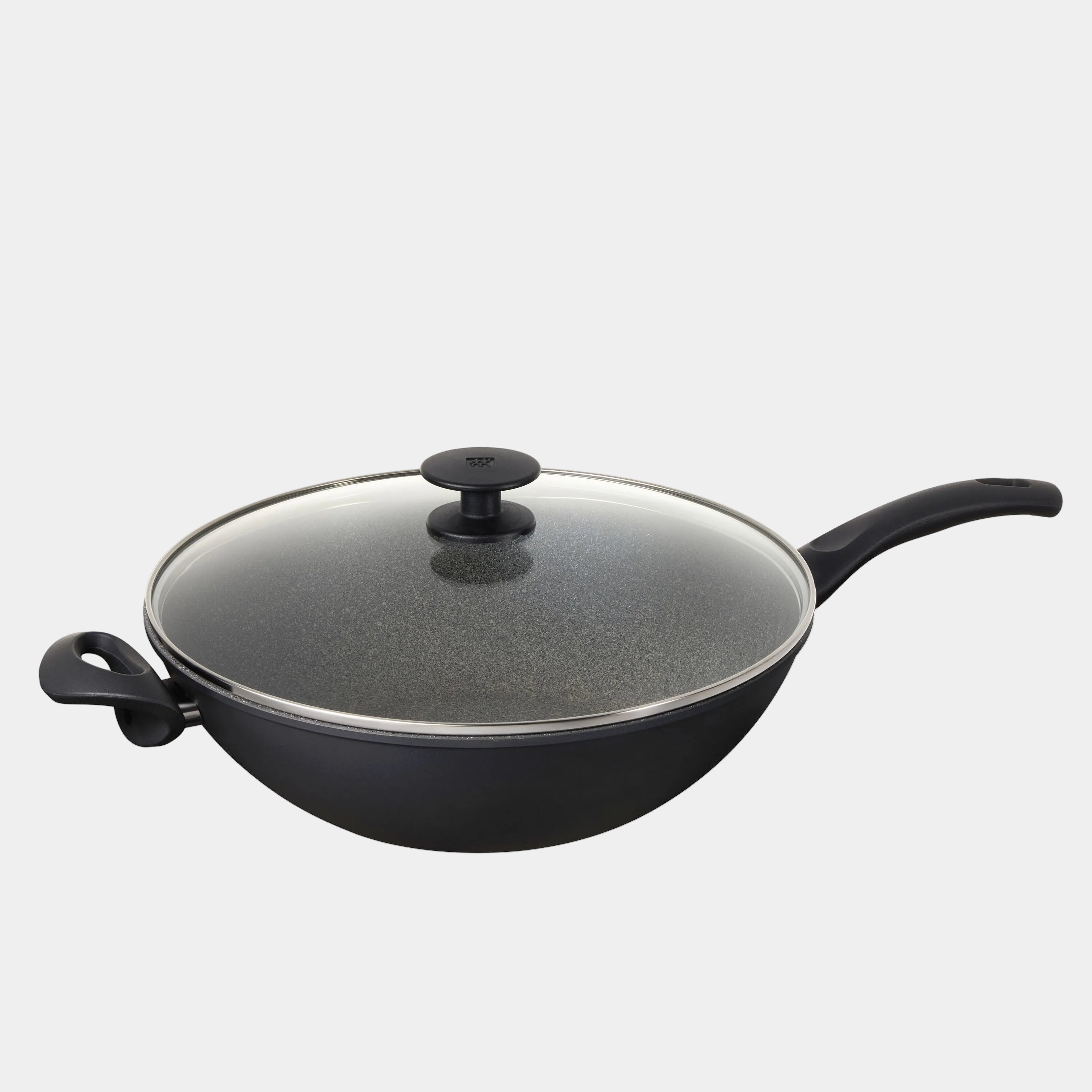 Black wok with a glass lid on a white background